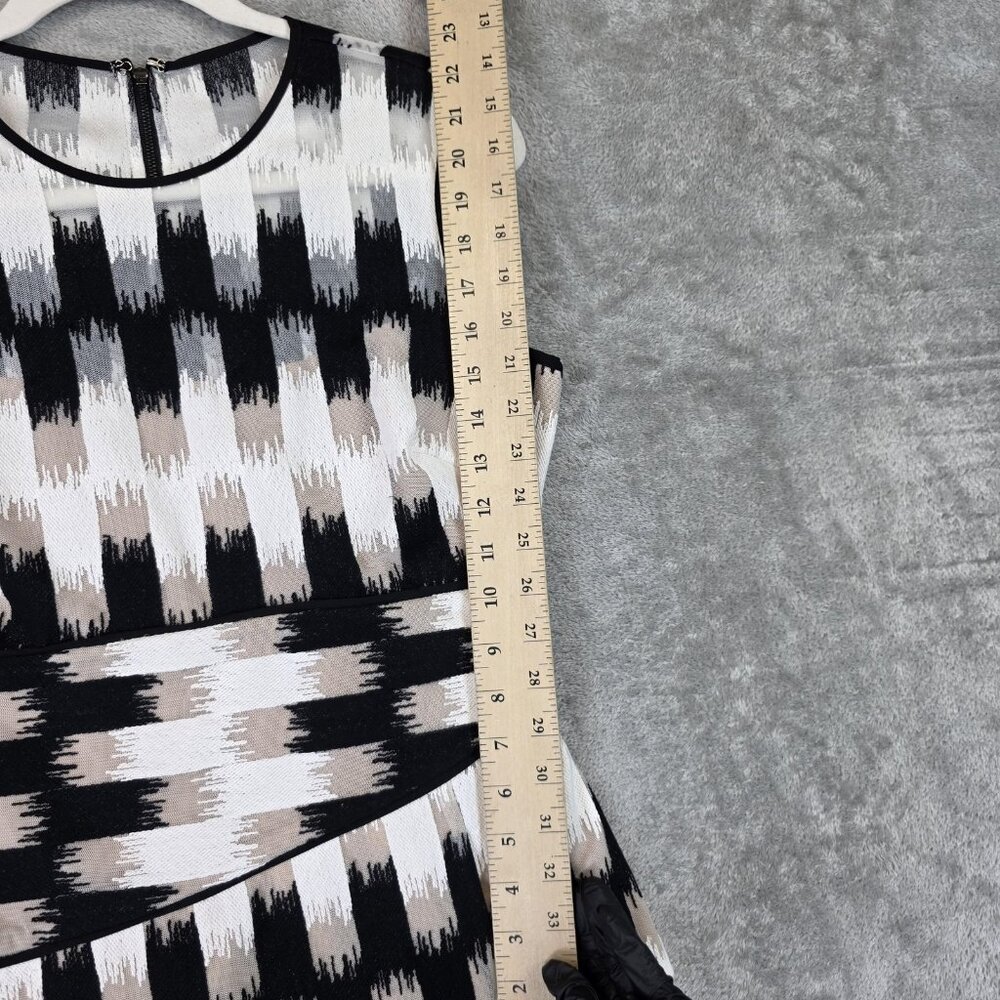 BCBGMAXAZRIA Blouse Womens S Black White Geometric Asymmetrical Peplum Top Lined - Picture 11 of 11
